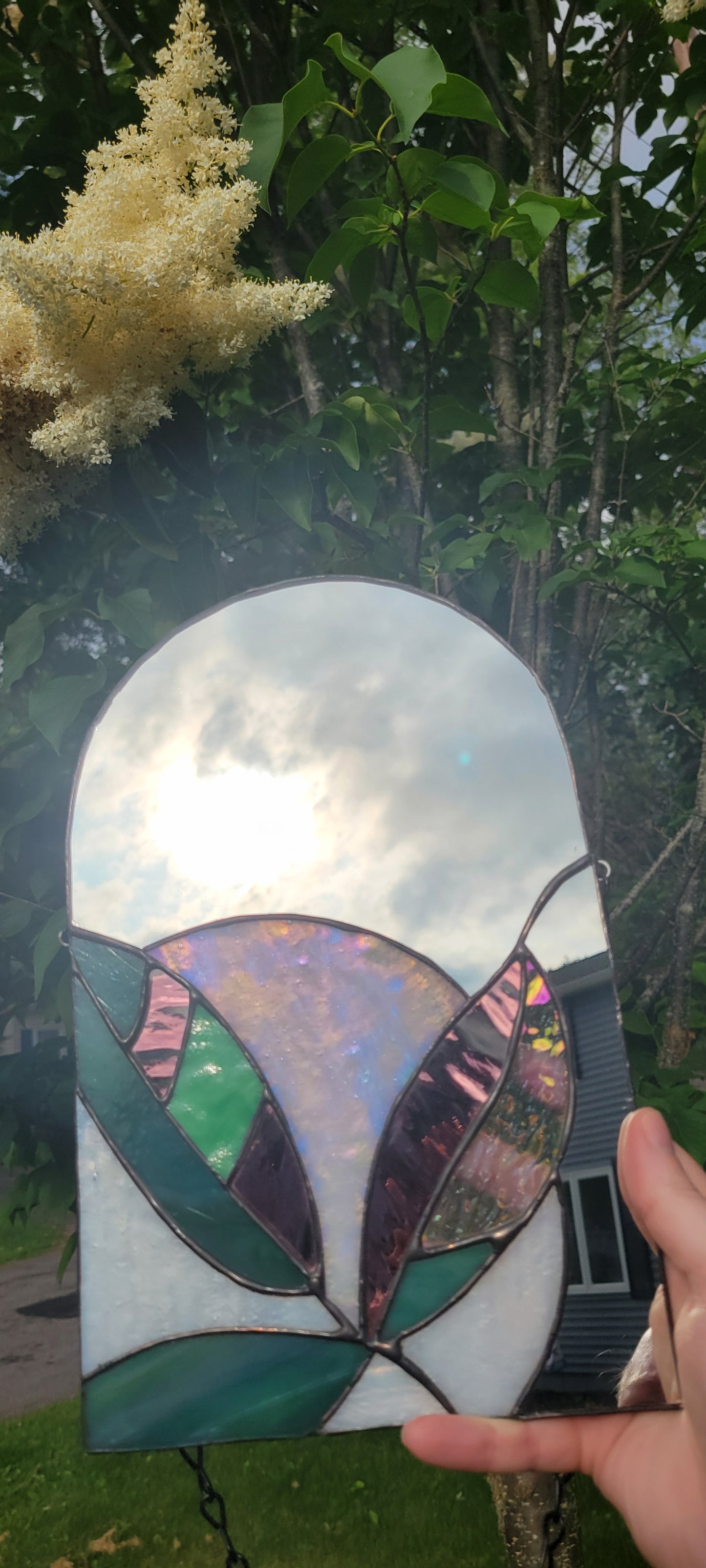 Stained glass mirror with moon and plants